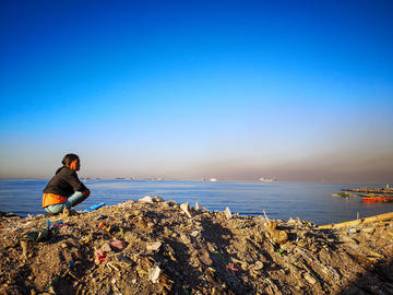 Woman along the shore in Manila bay