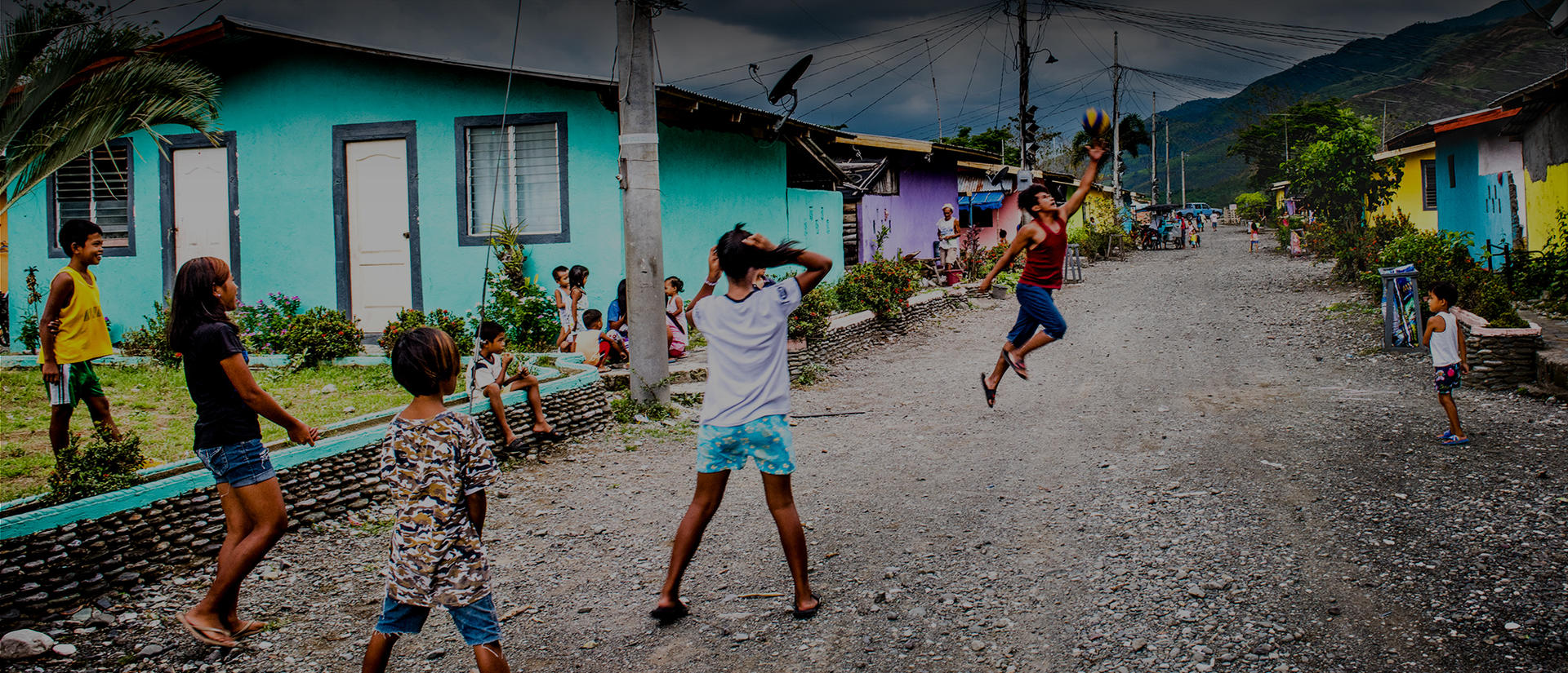 kids playing ball in street