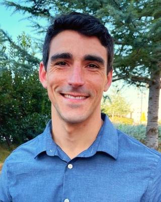 Sam Lewis smiling