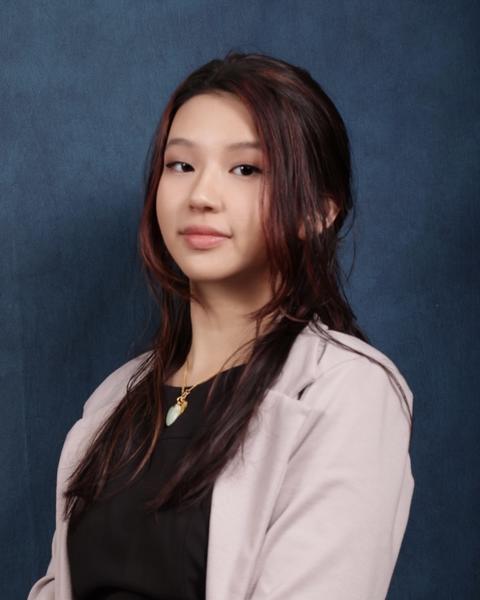 Michelle Wong against blue background